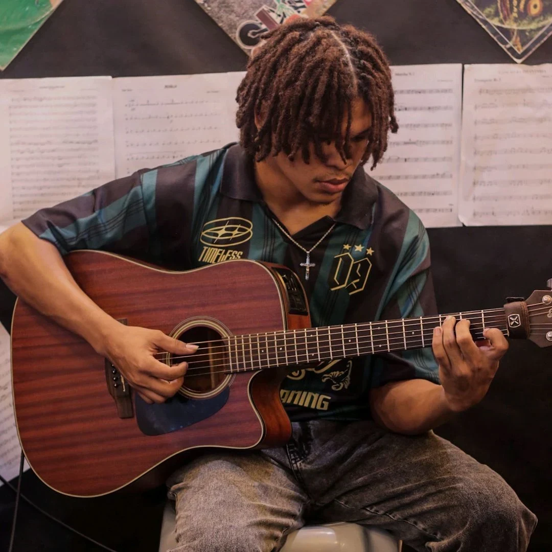 Black playing guitar